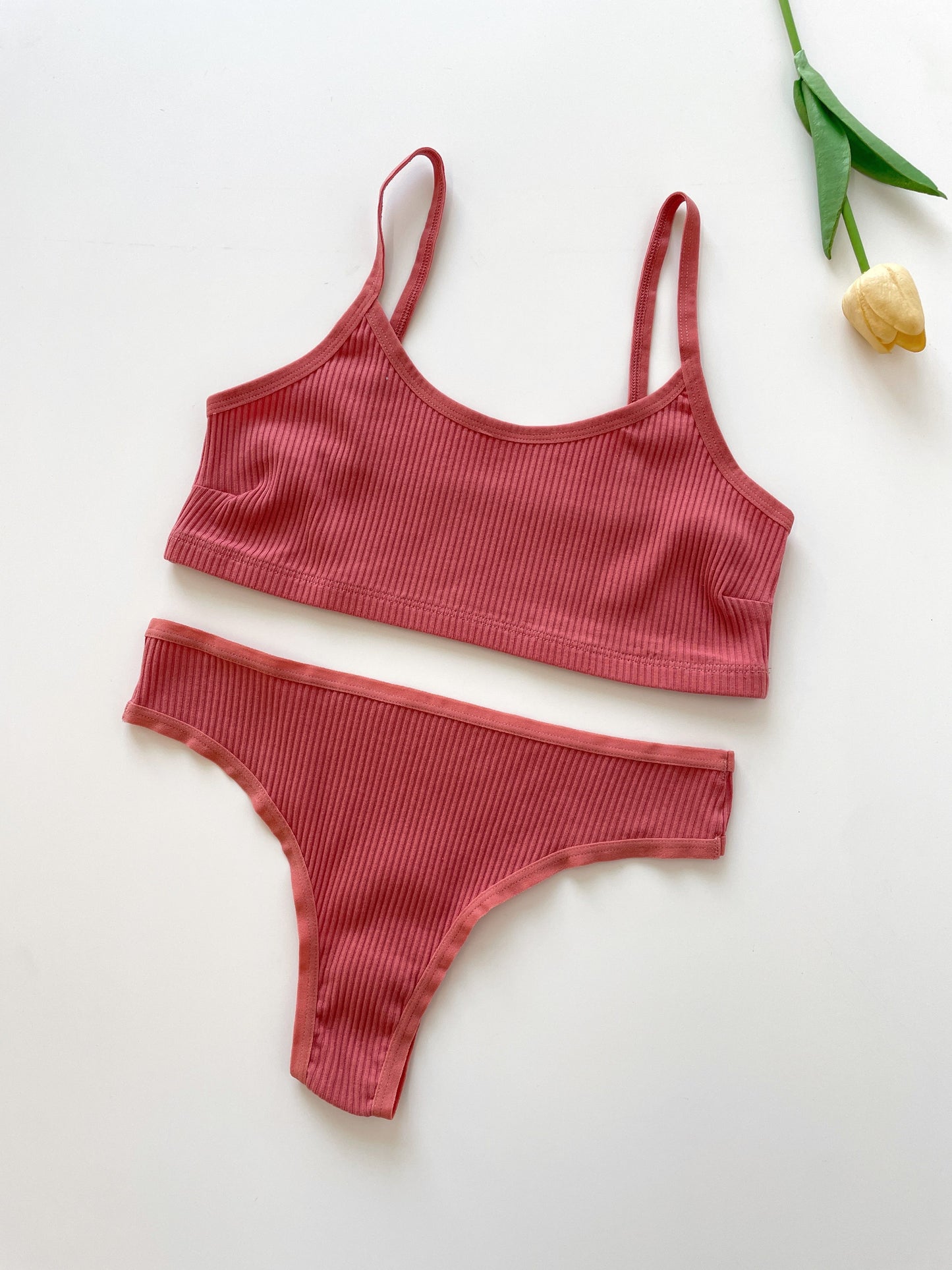 Elegant ribbed bra and thong set in 4 colors. Seamless, high-elasticity, and no-pad. Breathable and sweat absorbent for fitness and lingerie.