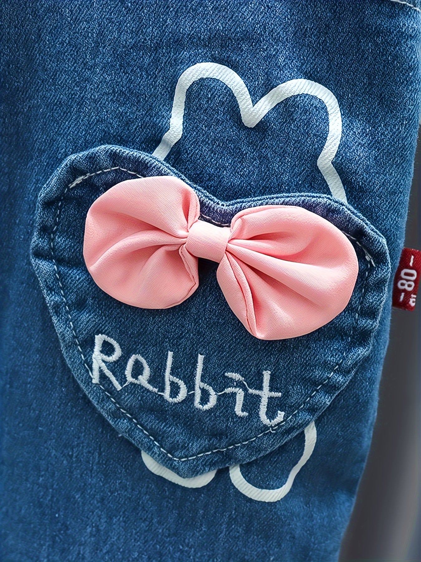 Baby girl's 2-piece denim overalls with rabbit embroidery plus ruffled blouse for spring and fall outdoor wear.