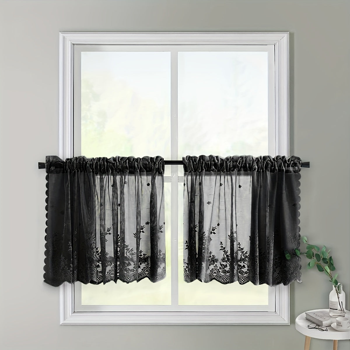 Elevate your space with this elegant black floral lace cafe curtain. Featuring a sweet and simple design, this curtain is made of sheer polyester and has a rod pocket for easy installation. Perfect for adding a touch of sophistication to your kitchen