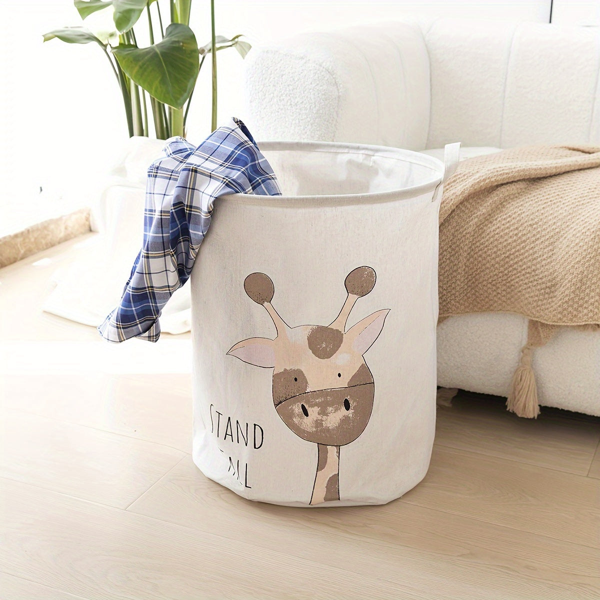 Collapsible fabric hamper with giraffe design, handles, and versatile storage for ages 12-14.