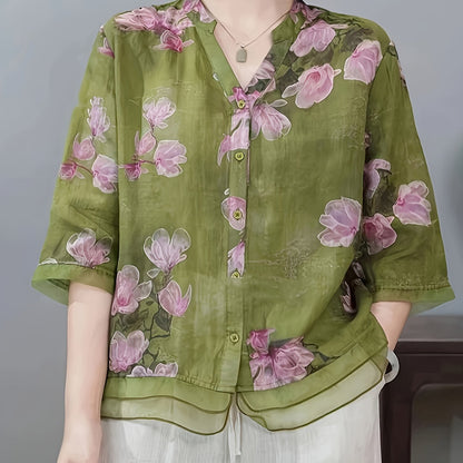 Women's floral print shirt with high neck, three-quarter sleeves, and cross hem. Made of polyester in a regular fit for weekend wear.