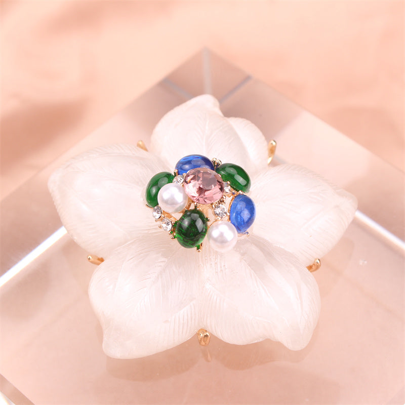 One piece of a luxurious iridescent floral brooch pin adorned with rhinestones. This elegant accessory features a novel simulated modeling design, making it a versatile fashion addition to clothing, bags, and hats.