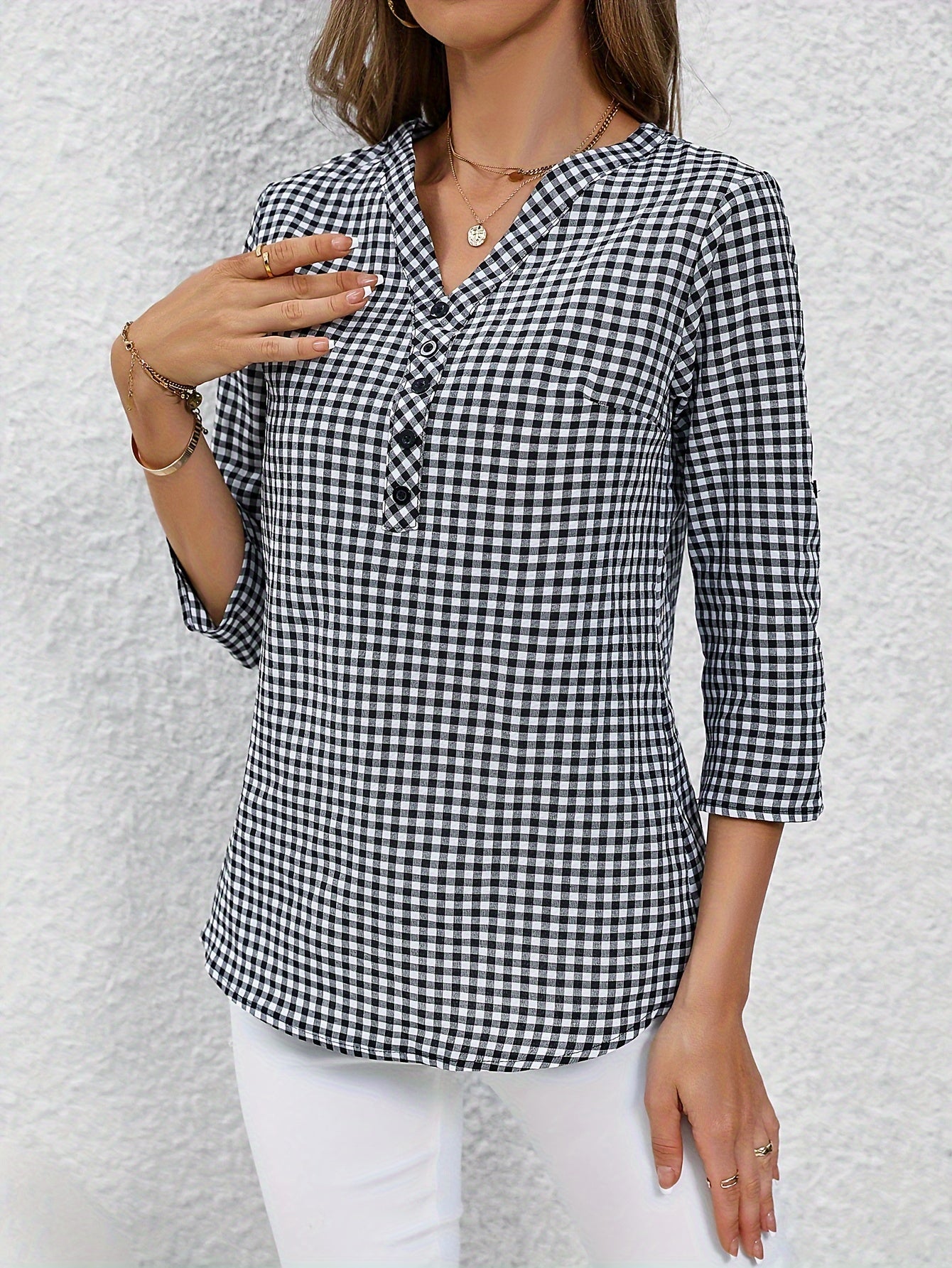 Women's yellow & white plaid button-up shirt with v-neck, long sleeves, and polyester fabric. Casual wear.