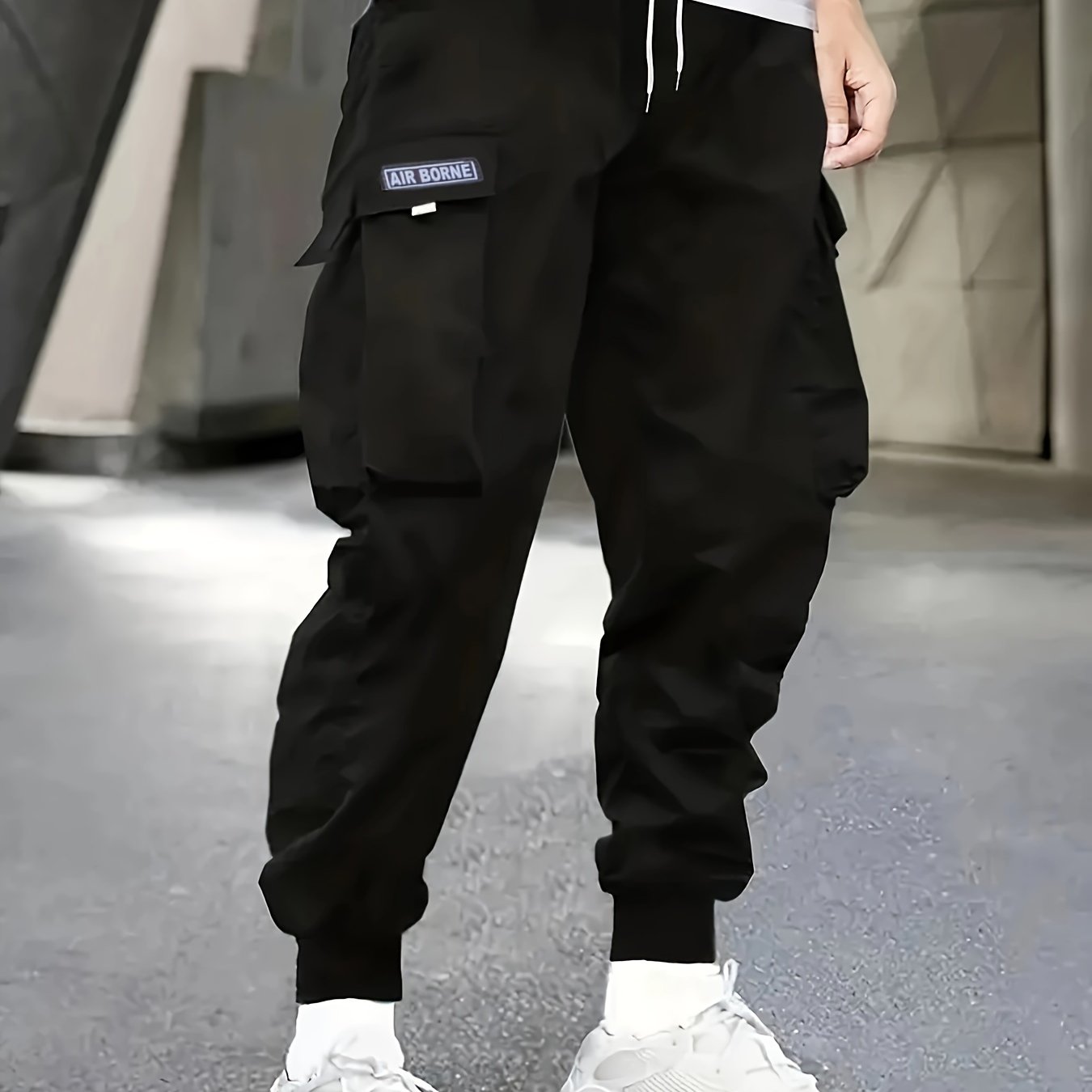 Japanese men's casual work pants with multiple pockets and loose, tied feet for spring 2023