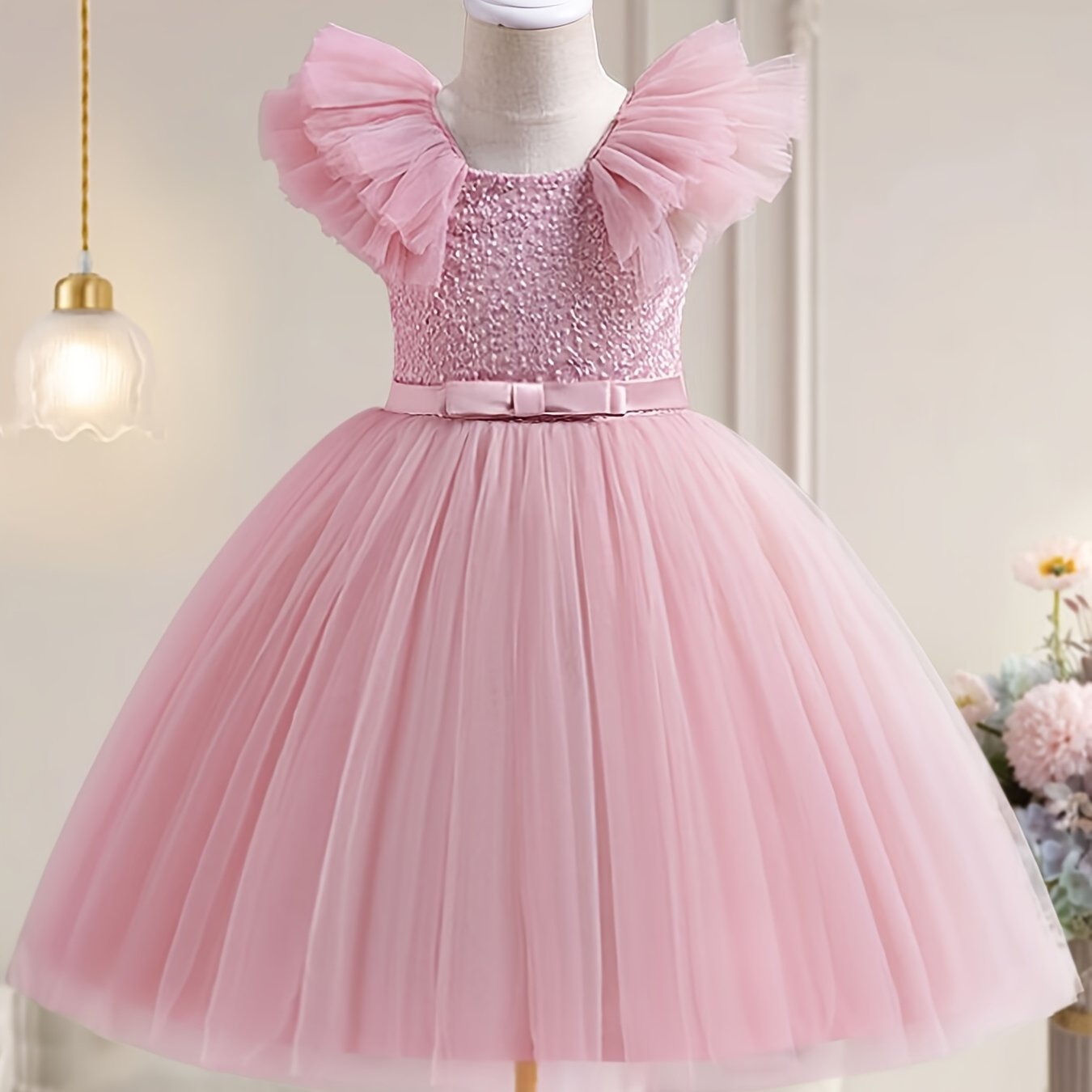 Elegant sleeveless tulle tutu party dress for girls, perfect for weddings and birthdays, made of 65% polyester and 35% viscose with a bow detail.