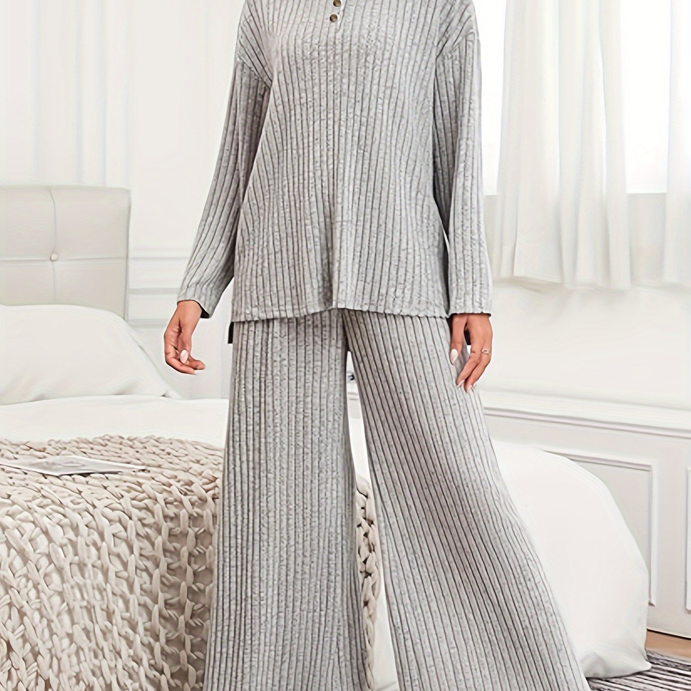 Women's casual suit with ribbed knit top and matching hooded wide-leg pants.