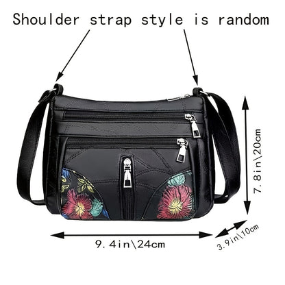 Stylish unisex crossbody bag with floral details, multiple pockets, and adjustable strap.