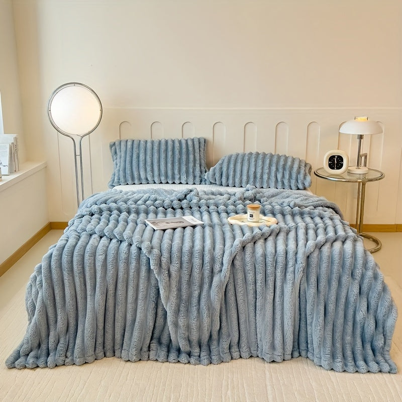 Stay warm and cozy with the FAGEJIE Luxury Faux Rabbit Fur Throw Blanket. Ideal for snuggling up on the sofa, bed, or while traveling. This all-season comfy gift is perfect for Christmas and is made of a soft polyester blend. Hand wash only and suitable