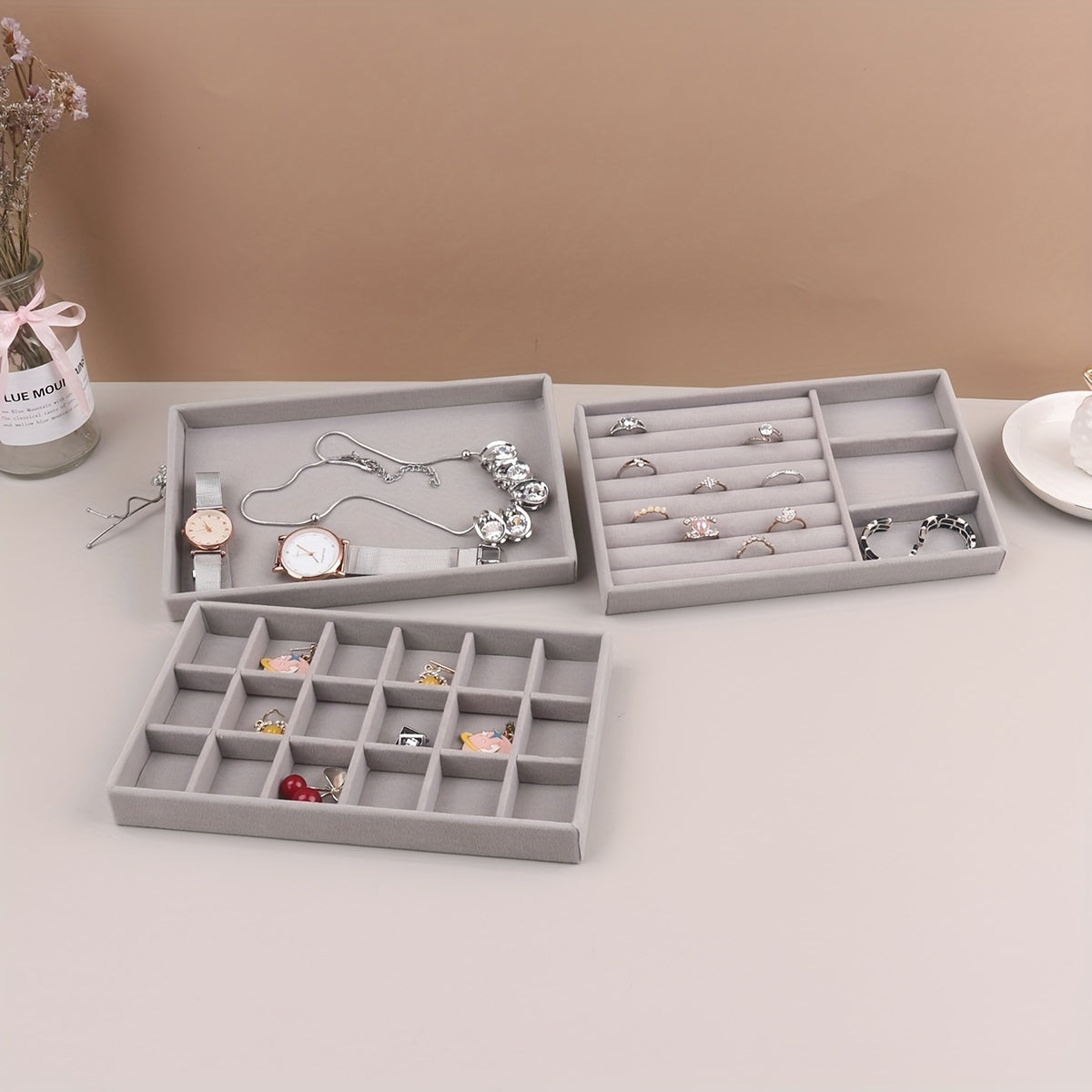 1 piece Grey Velvet Jewelry Tray with compartments for necklaces, bracelets, earrings, rings, bangles, and watches, with a velvet drawer for organization.