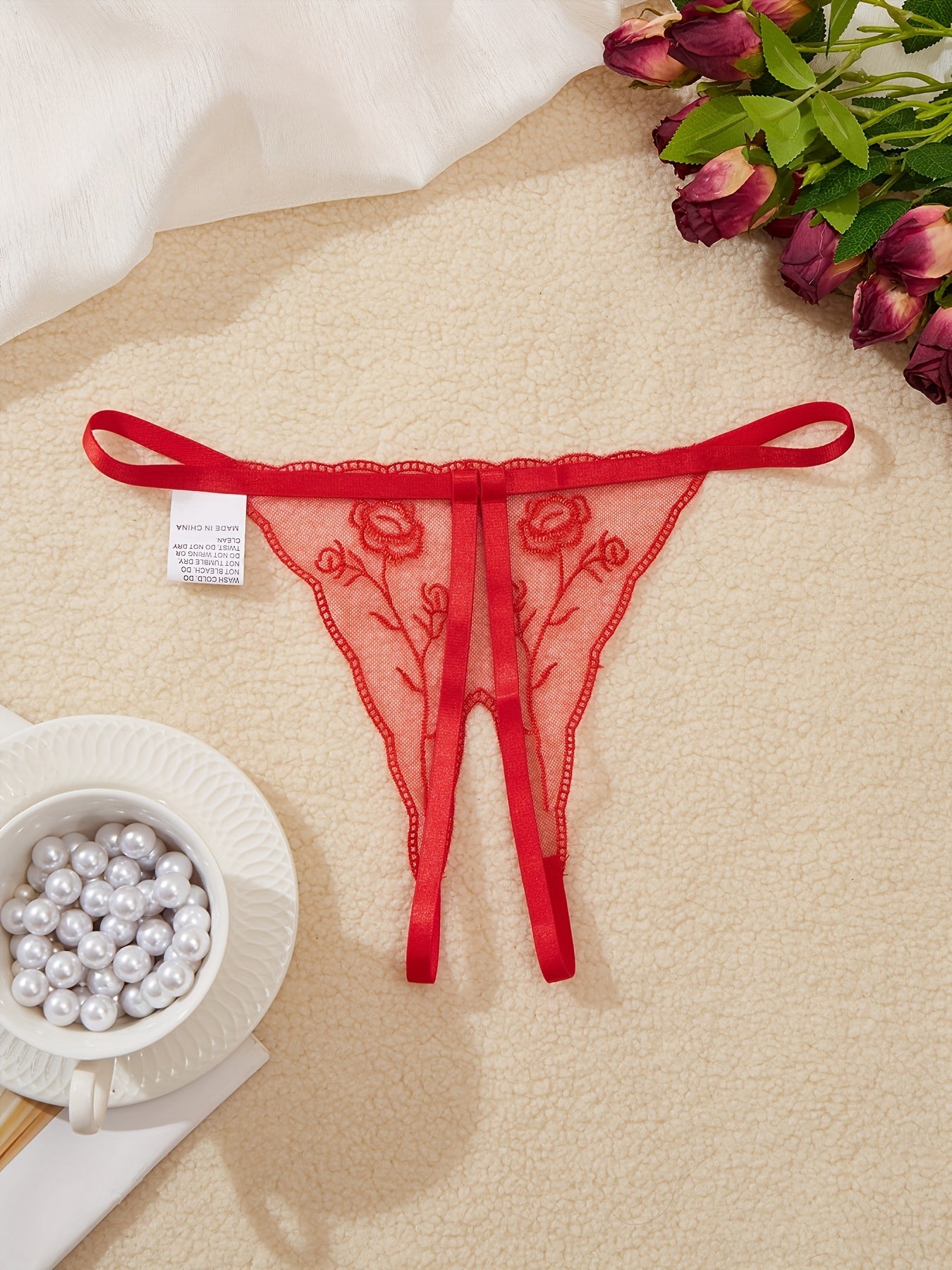 Women's sexy low waist panties with embroidered pattern charm design.