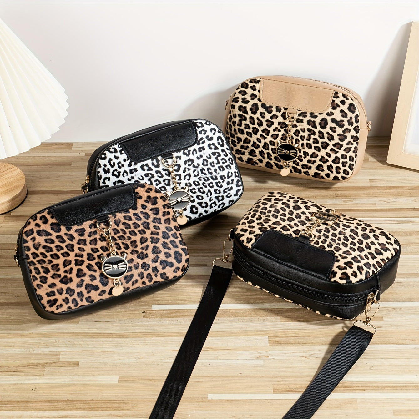 Chic leopard print crossbody bag with adjustable strap, cat charm, zip closure, and polyester lining - ideal for work, outings, and daily commutes.