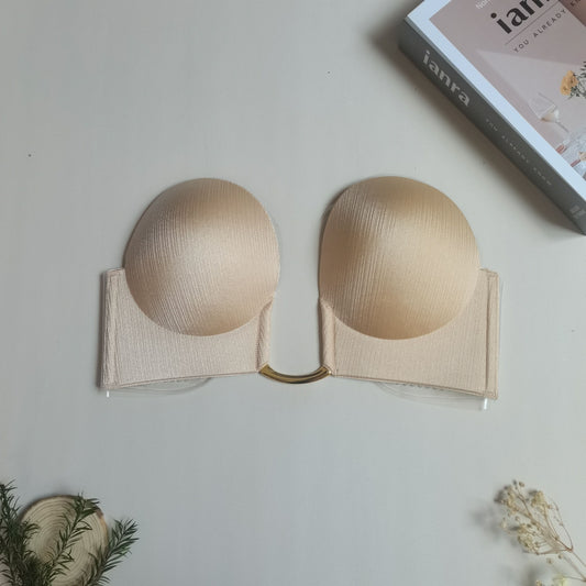 Stick-on lift bra provides invisible strapless and seamless push-up for women's lingerie and underwear needs.