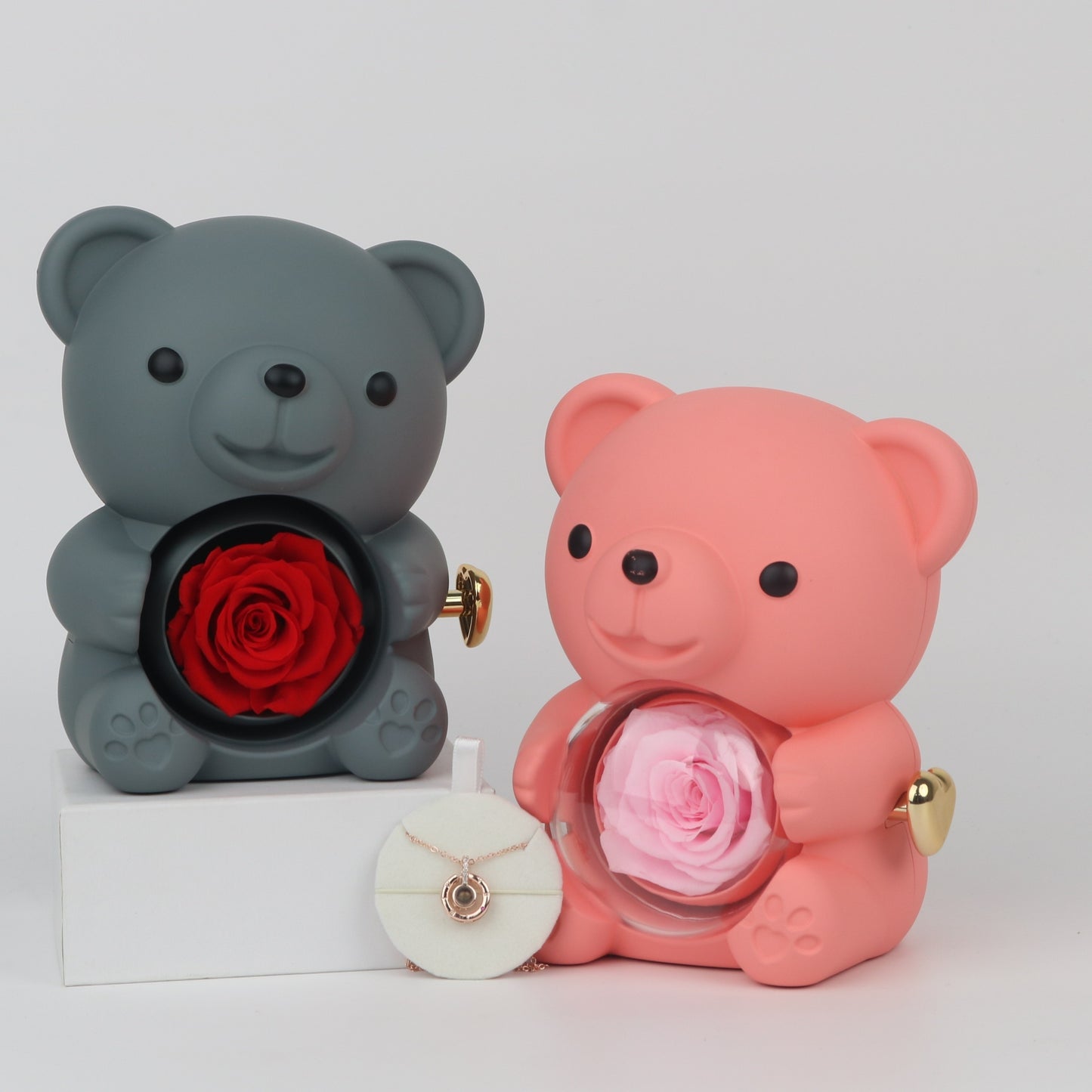 Art Deco style rotating jewelry box with bear hug flower design, made of plastic with "Love You" message and gift box included.