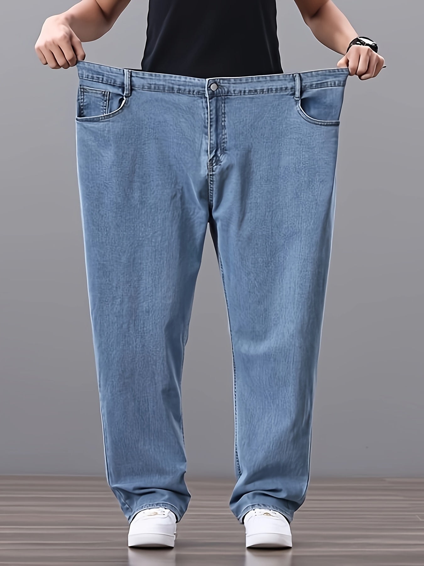 Men's high-waisted denim jeans with stretch fit in a solid color. Features regular fit, straight leg, and made of 45% cotton, 33% polyester, 1.5% spandex, 20.5% rayon. Lightweight at