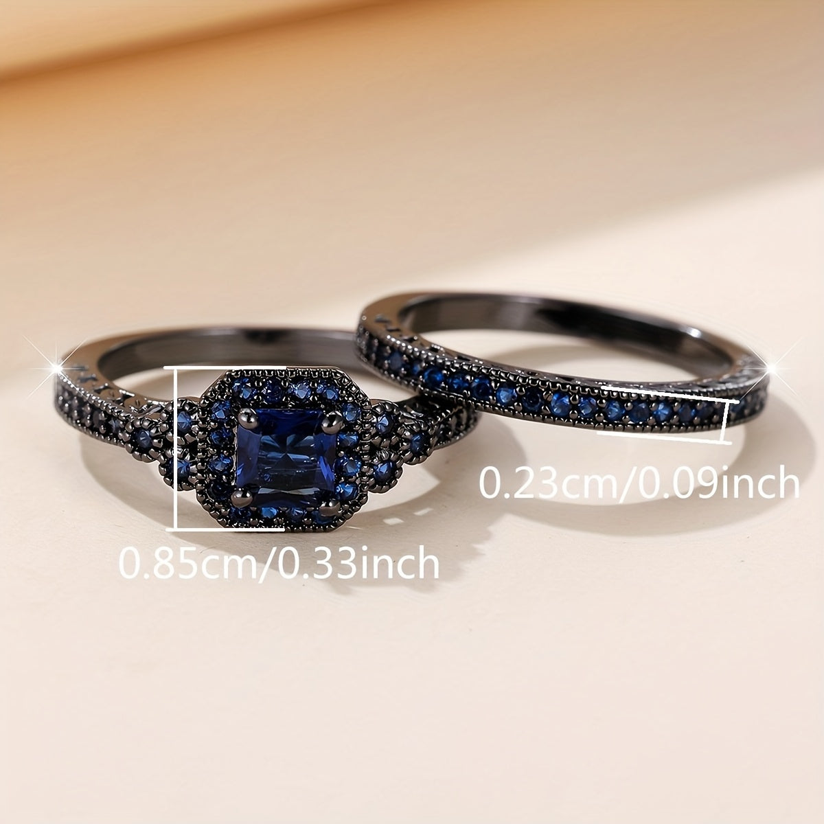 Set of 2 elegant promise rings featuring a halo ring with a dark blue zirconia stone and an eternity ring, perfect for engagement or wedding jewelry. Ideal for brides to enhance their evening party attire.