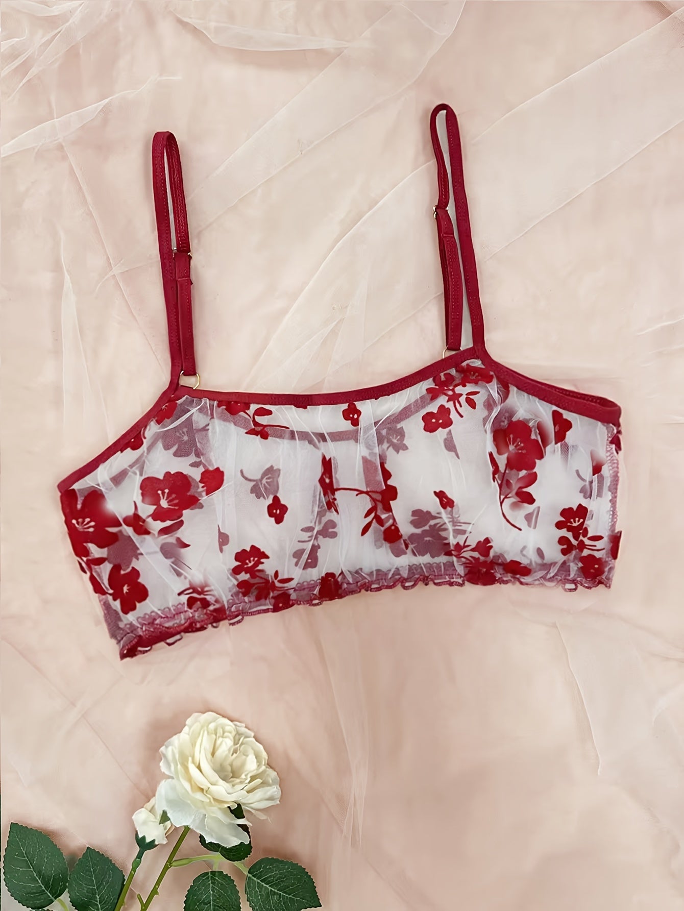 Lingerie set with floral print tulle, see-through bow bra, and tempting thong.