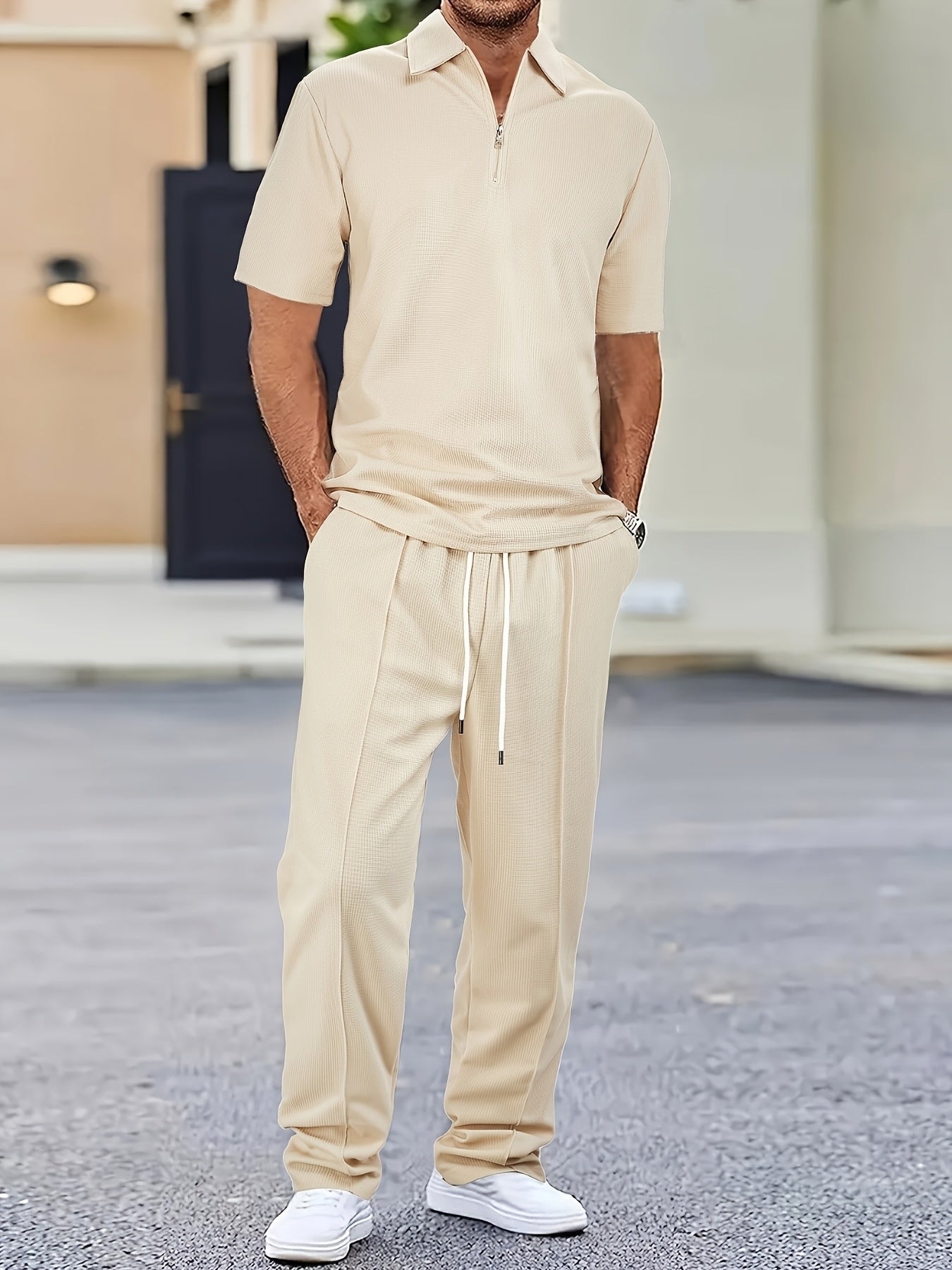 Men's casual outfit with waffle knit short sleeve zip-up shirt and drawstring pants in black. Made of polyester blend, perfect for spring/summer.