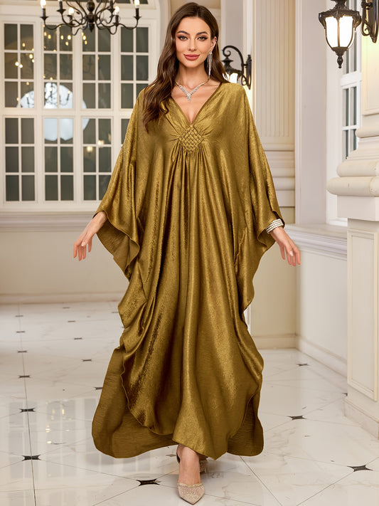 Stylish olive green V-neck kaftan dress with bat sleeves. Ideal as a beach cover-up or casual outerwear for women. Offers sun protection and a loose fit, perfect for spring/summer/fall