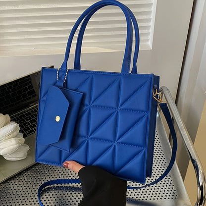 Black quilted synthetic leather tote bag with gold-tone hardware and detachable crossbody strap. Includes matching coin purse. Perfect for work, office, and everyday use. Ideal commuter