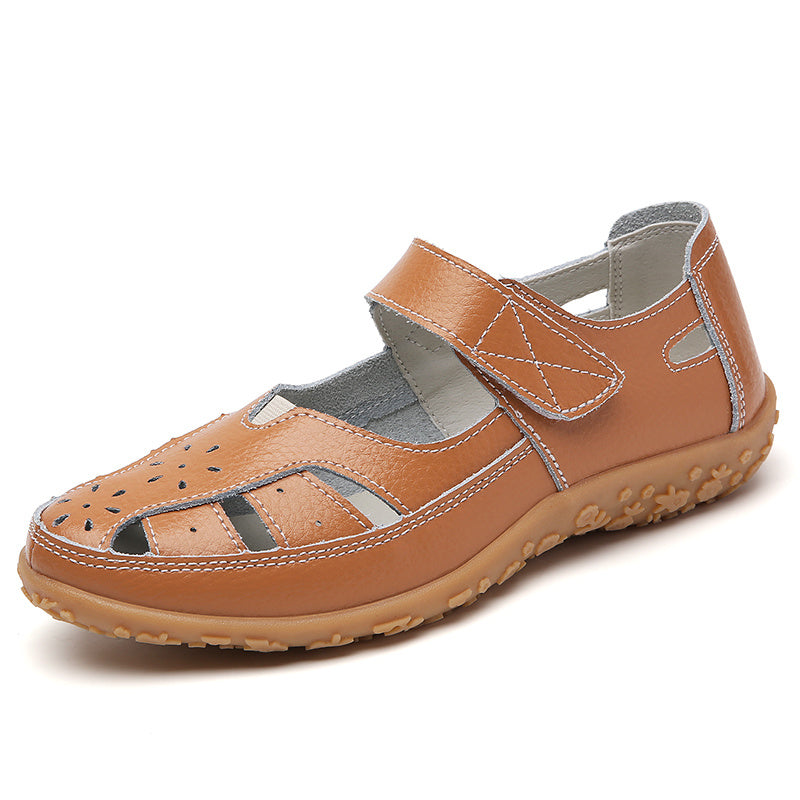 Cut-out flat sandals for women with soft soles and hook & loop closures, ideal for casual walking with their non-slip closed-toe design.