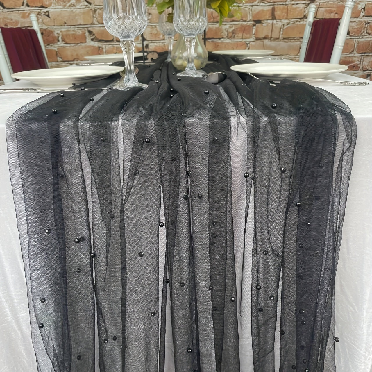 Enhance the ambiance of your special events with our Romantic Pearl Lace Table Runner. Perfect for weddings, bridal showers, and more, this elegant decoration is crafted from embroidered sheer chiffon tulle that is wrinkle-free for a luxurious look.