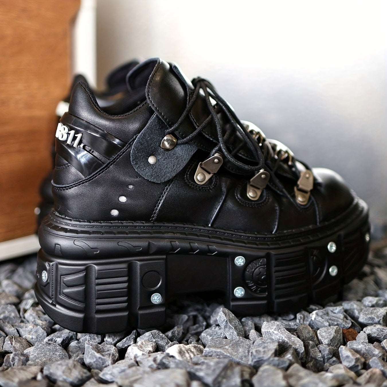 Black women's mid-top sneakers with metallic accents, waterproof, thick platform sole, lace-up Y2K goth style.