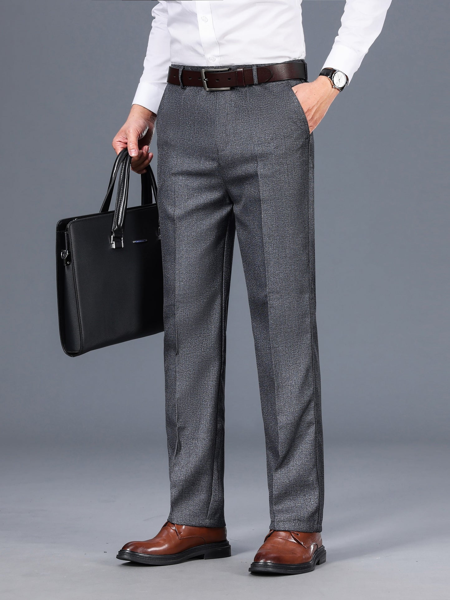 Gray dress pants for men with a straight fit, medium thickness, slant pockets, zip closure, and non-stretch polyester fabric. Suitable for business casual or formal wear in spring and