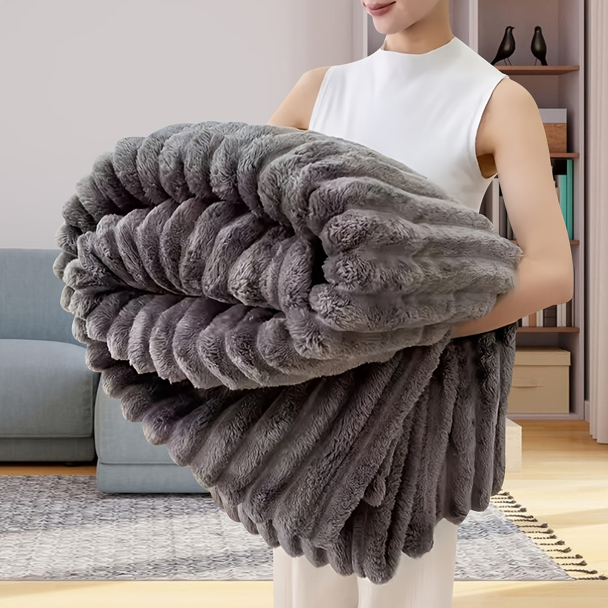 Upgrade your comfort with this dual-sided striped fleece throw blanket. The ribbed texture adds a touch of luxury, while the cozy and warm material makes it perfect for any season. Whether you use it for naps, in the office, or in the bedroom, this