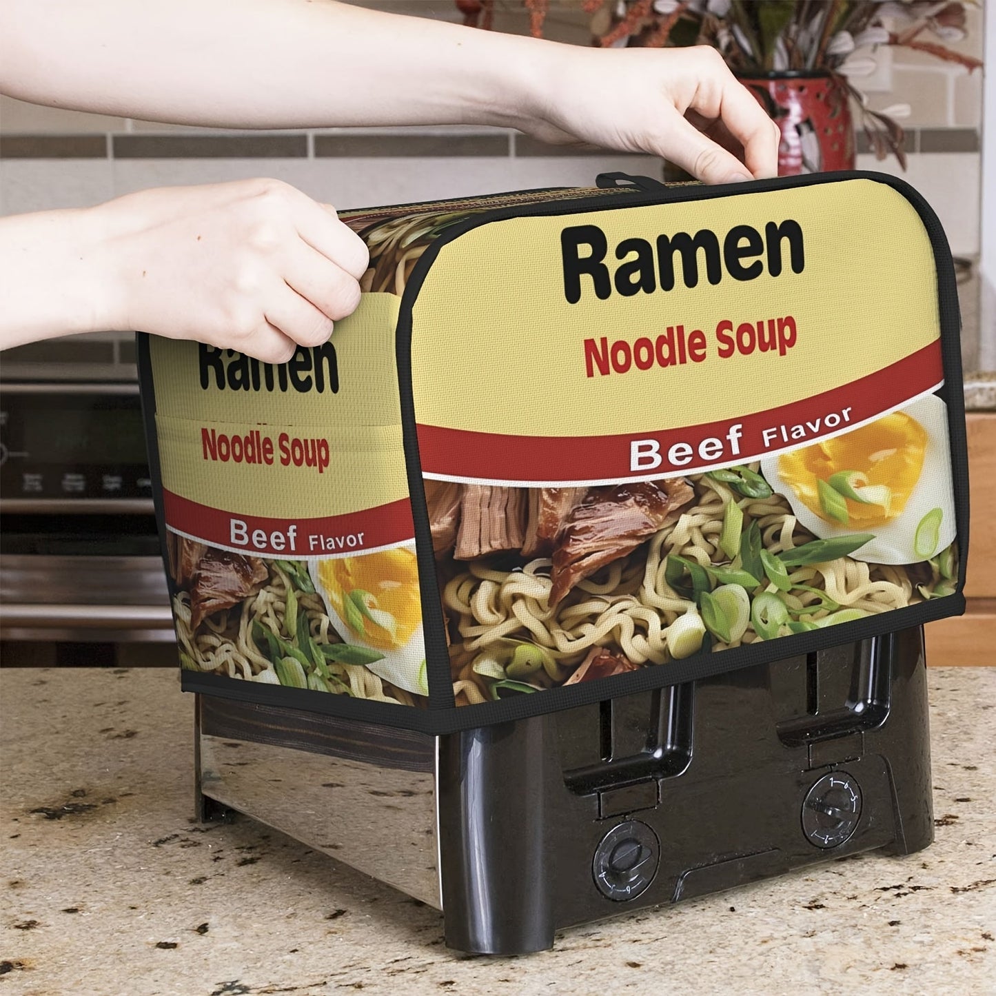 Introducing a charming ramen print toaster cover featuring beef and chicken flavors, crafted to safeguard your toaster from dust and fingerprints. This cover is conveniently machine washable and designed to fit two-slice toasters, ensuring it remains a