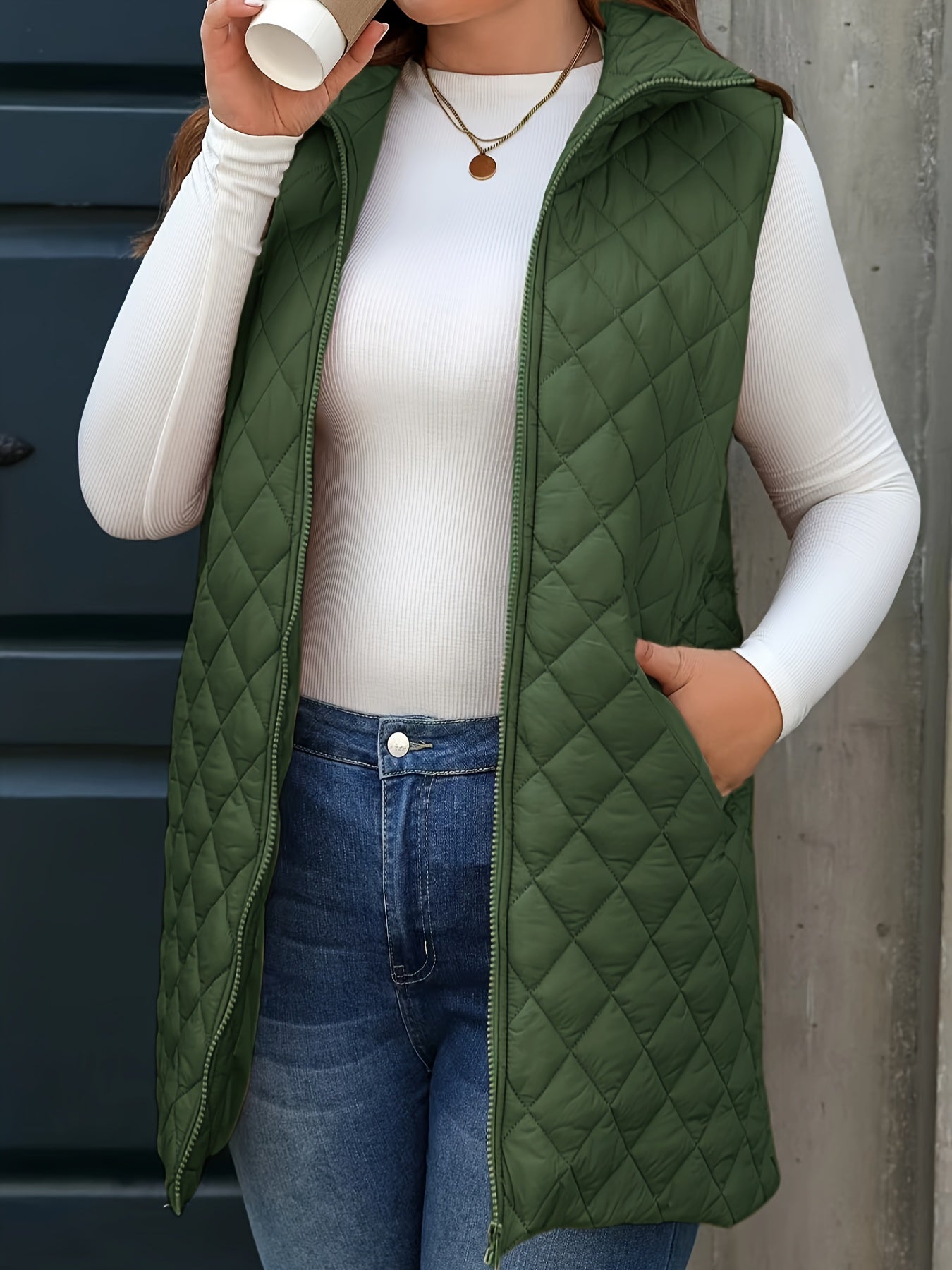 Chic plus-size quilted vest with stand collar and mid-length zip-up closure for winter wear.