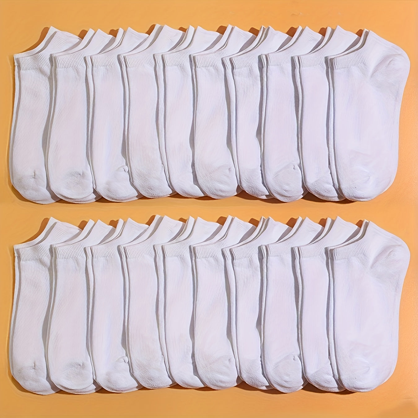 20 breathable ankle socks in versatile solid colors. Made of polyester blend, machine washable, and suitable for all seasons. Cute and comfortable.