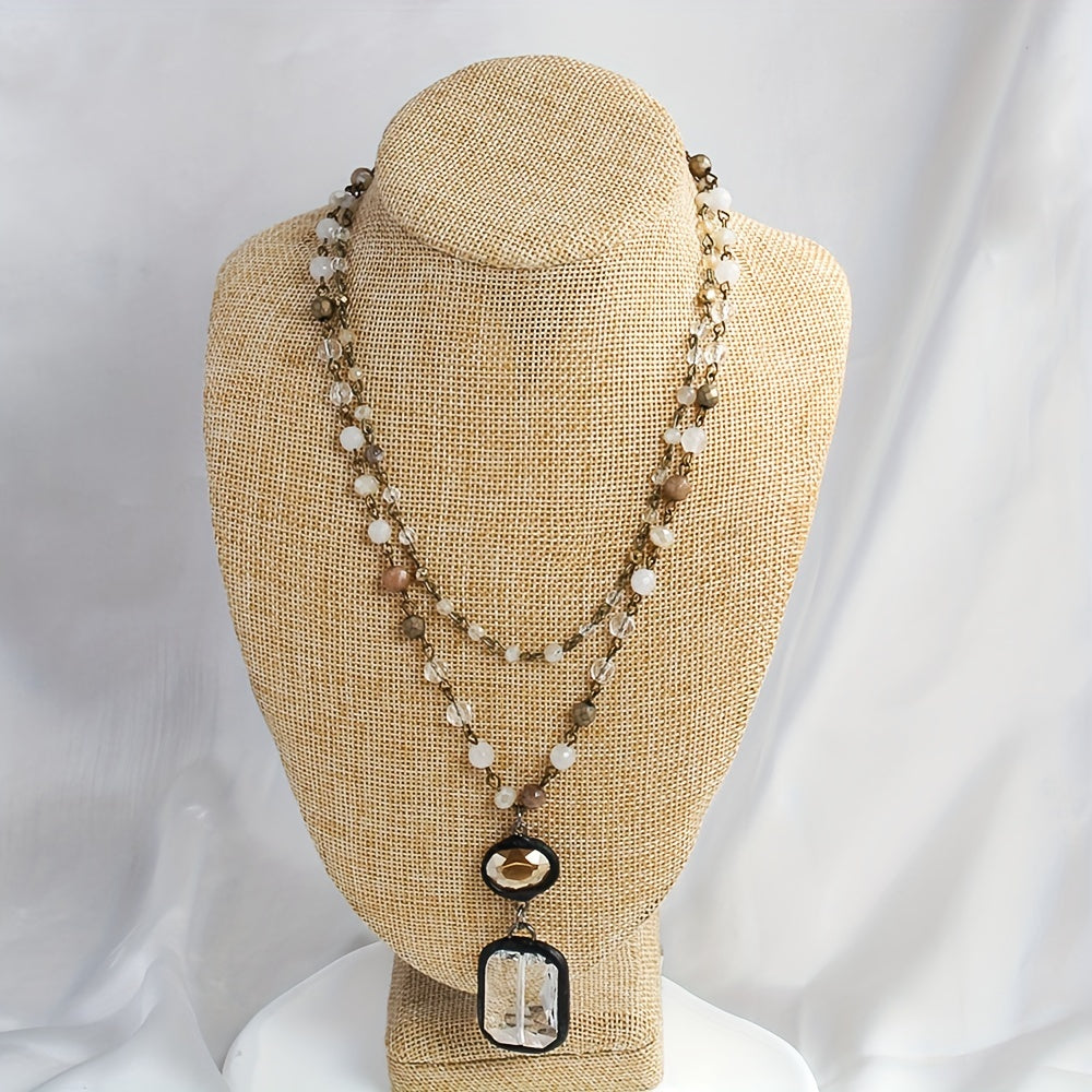 New tribal style necklace featuring two layers of natural stone crystals and glass chains, with a square glass pendant designed for daily wear by both men and women during the spring and summer seasons.