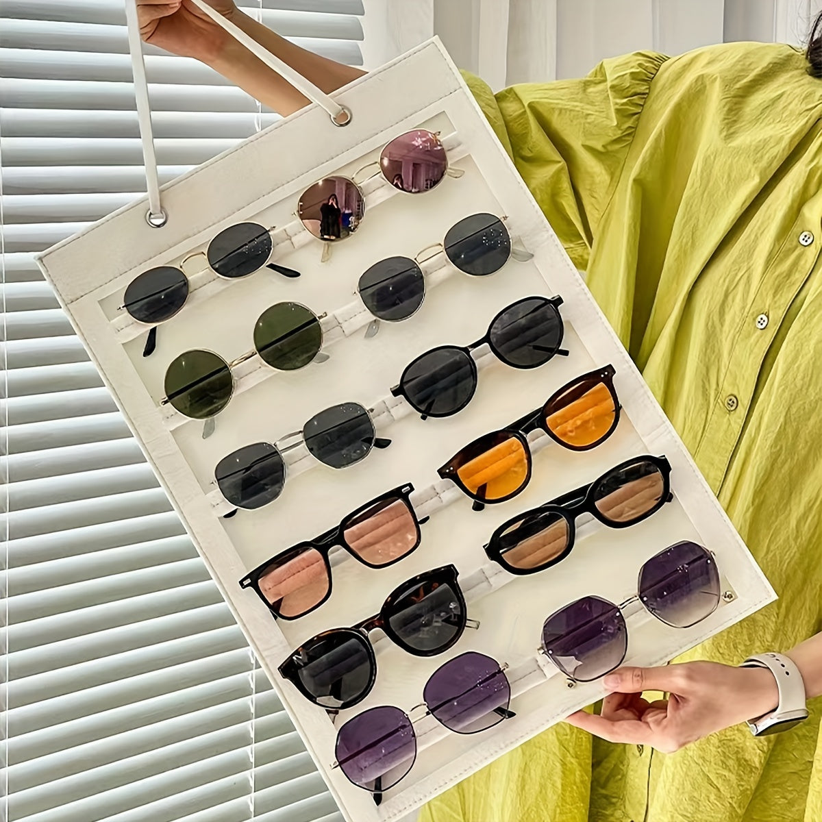 Organize your sunglasses with this hanging wall organizer featuring 12 slots made of felt. Keep your glasses dust-proof and easily accessible with this storage display pocket wall stand holder.