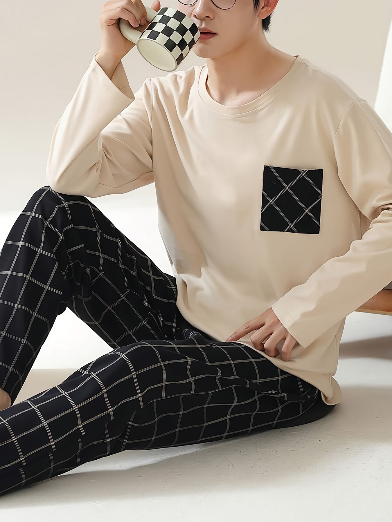 Men's beige long sleeve pullover with pocket, plaid pants in a soft and comfortable sleepwear set. Casual style, regular fit in knit polyester blend fabric - perfect for all seasons.