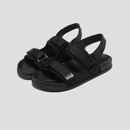 Women's stylish black summer beach slide sandals with adjustable hook-and-loop fastener straps, flat heel, open toe, PVC sole for easy cleaning and comfort.