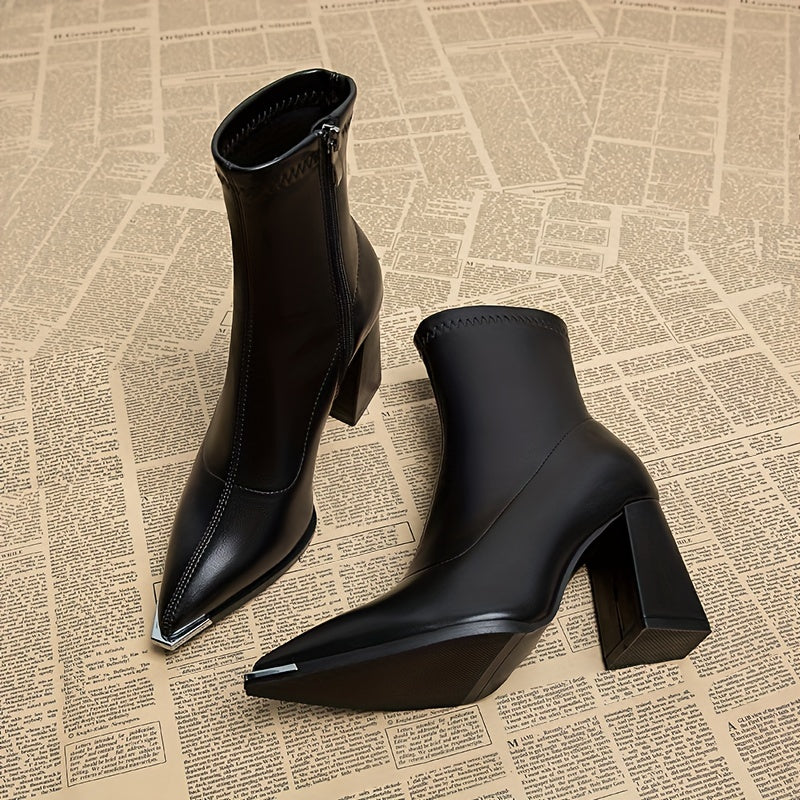 Stylish ankle boots with pointed toe, chunky heel, faux cover, and side zipper closure for all seasons.