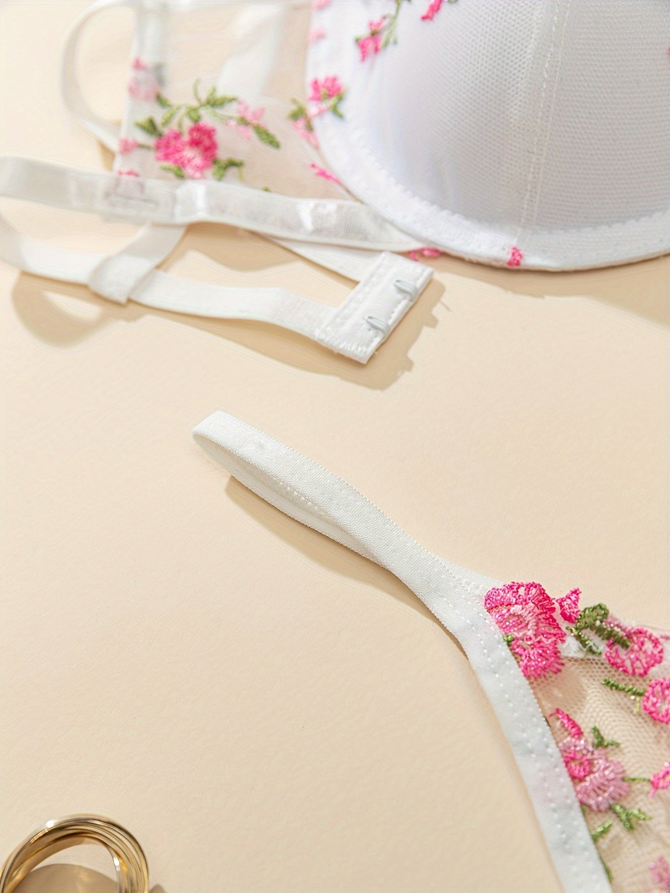 Floral embroidered lingerie set for women - underwire bra & mesh thong, breathable polyester blend, non-removable pads.