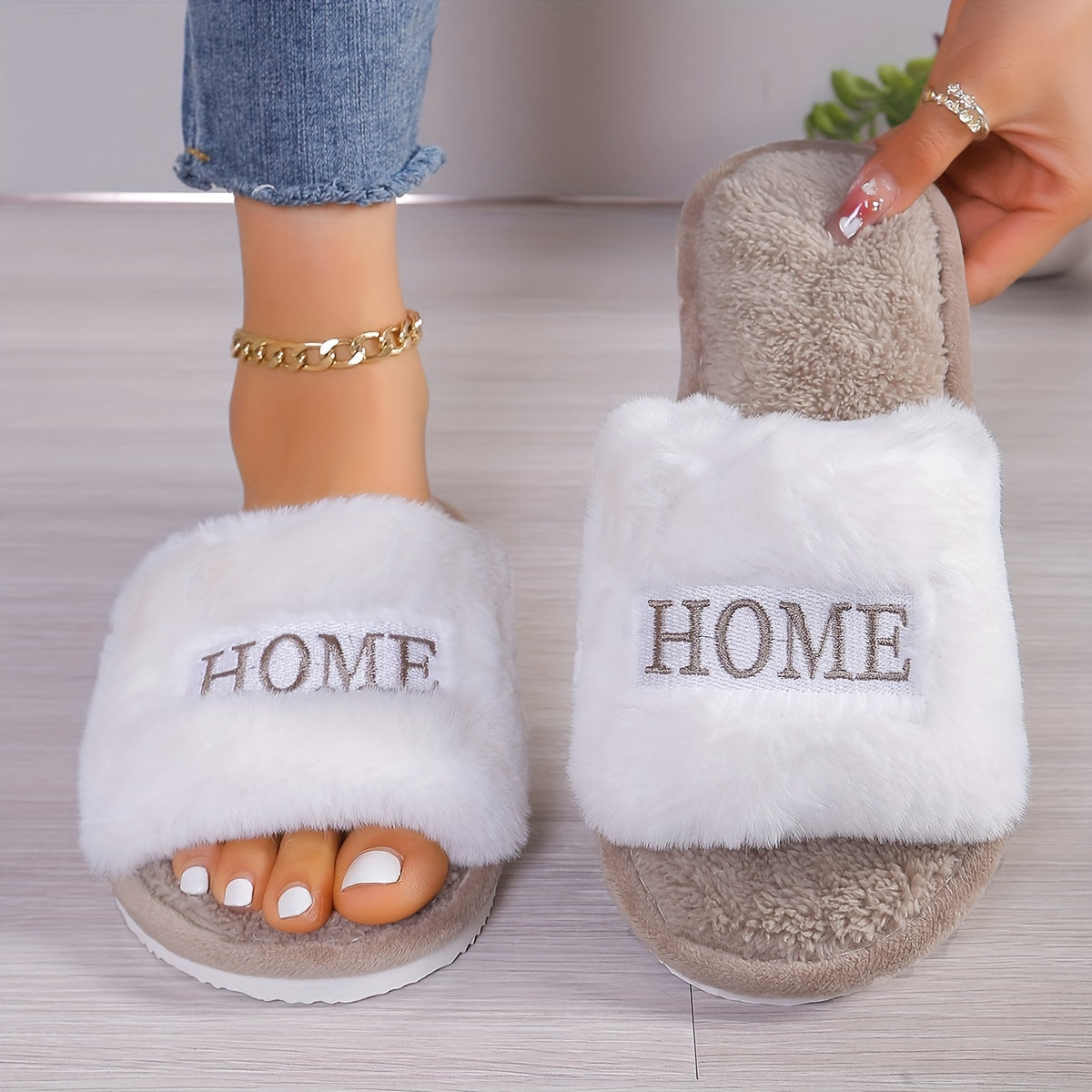 White plush slippers with "HOME" embroidery, cozy and comfortable for all seasons.