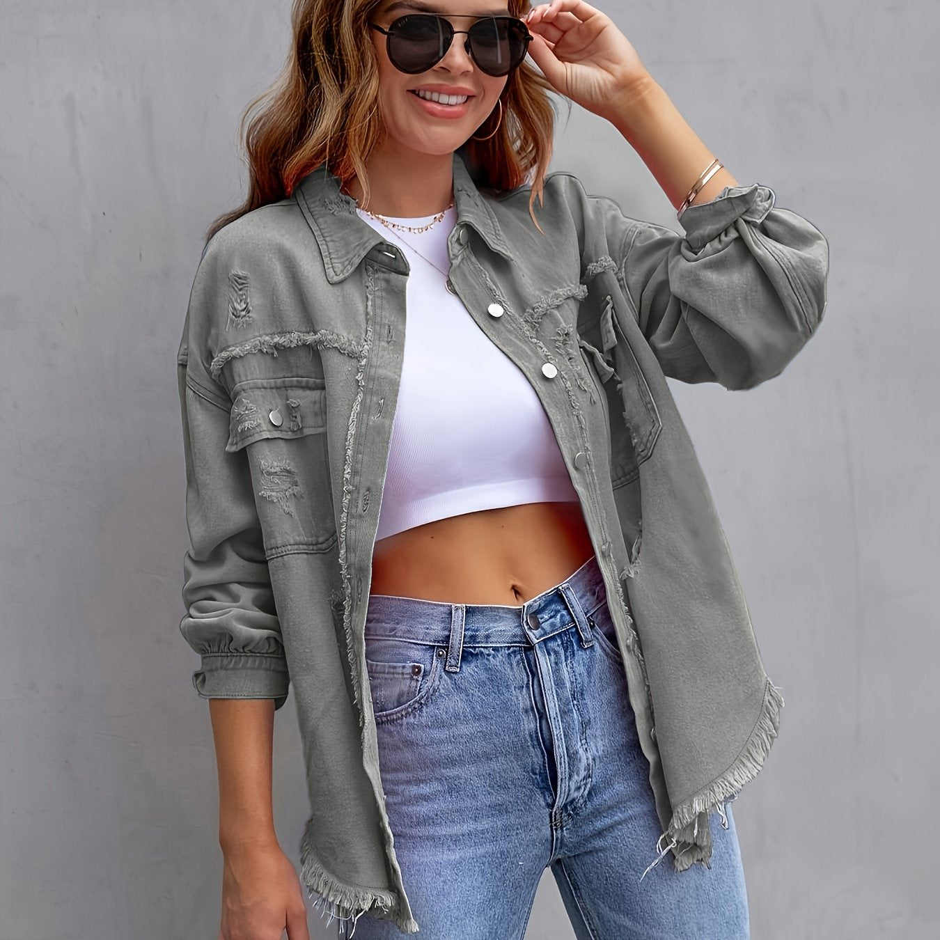 Women's plus size distressed denim jacket with boho style, button detail, and lapel collar made of rayon/viscose blend fabric. Suitable for spring/fall fashion.