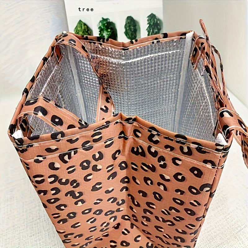 Get ready for your next picnic with this portable handheld lunch bag! Made from durable Oxford cloth and aluminum foil, this bag features a stylish leopard pattern and is perfect for keeping your food insulated. It's also a great gift idea for Christmas