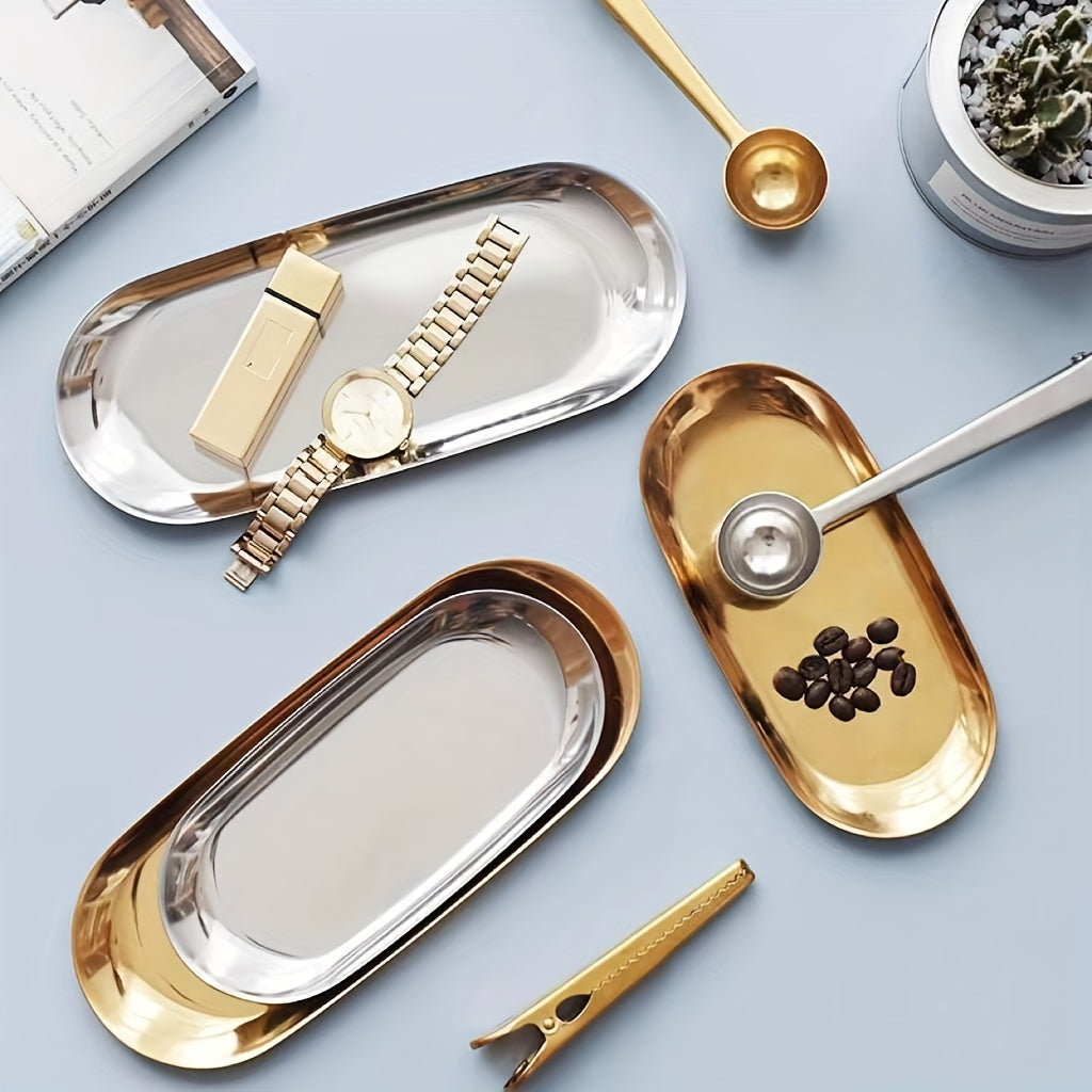 Stainless steel oval tray for jewelry, toiletries, or serving dim sum.