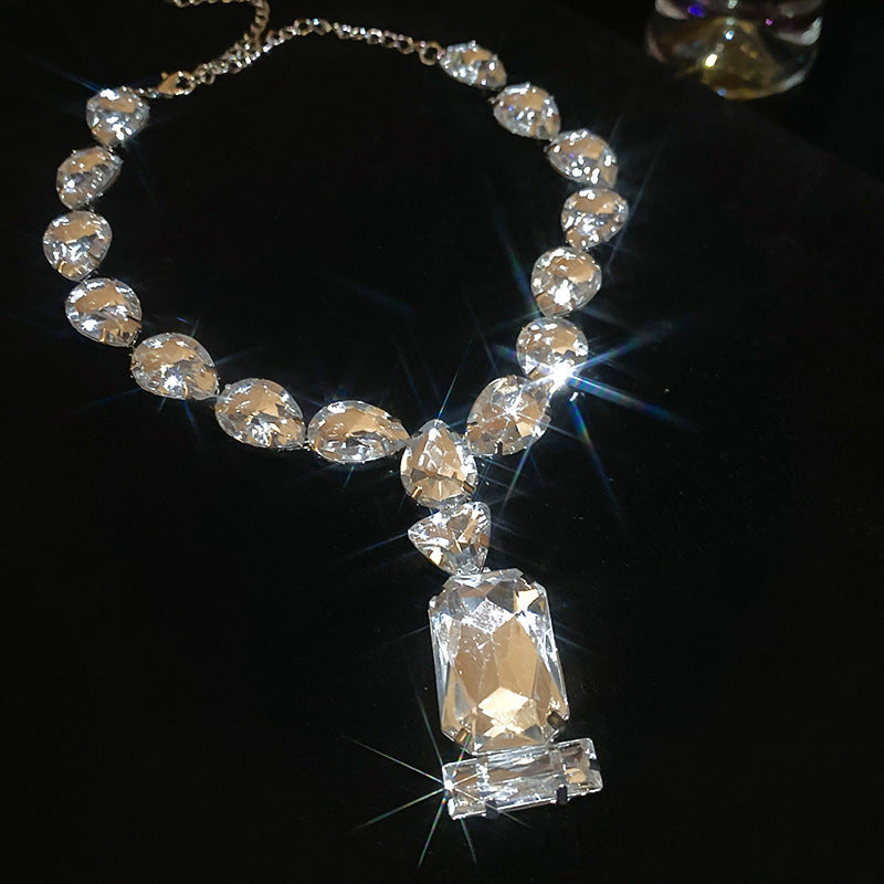 Stunning pendant necklace featuring a blend of Japanese and Korean styles, adorned with rhinestones. This iron jewelry showcases a unique rectangular and teardrop crystal design, perfect for adding a touch of elegance to parties and music festivals. A