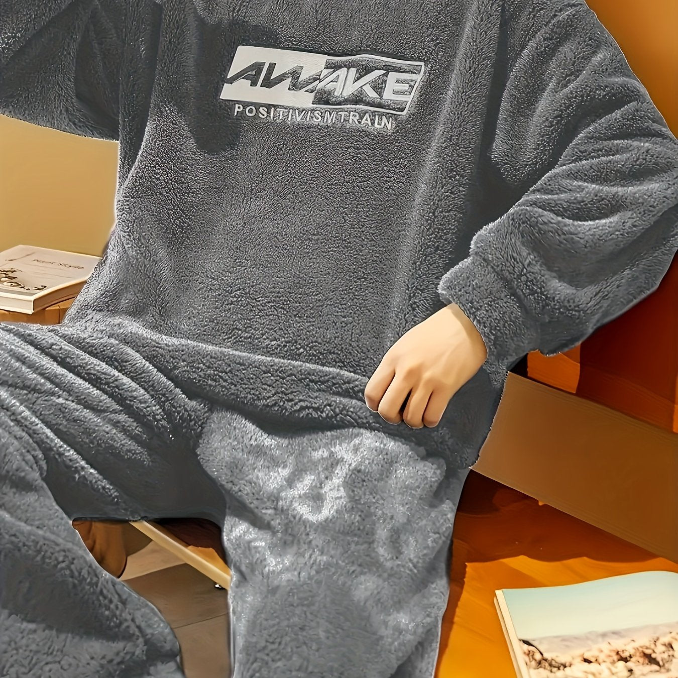 Comfy fleece pajama set for men with long sleeve top and loose-fit pants, perfect for fall/winter lounging.