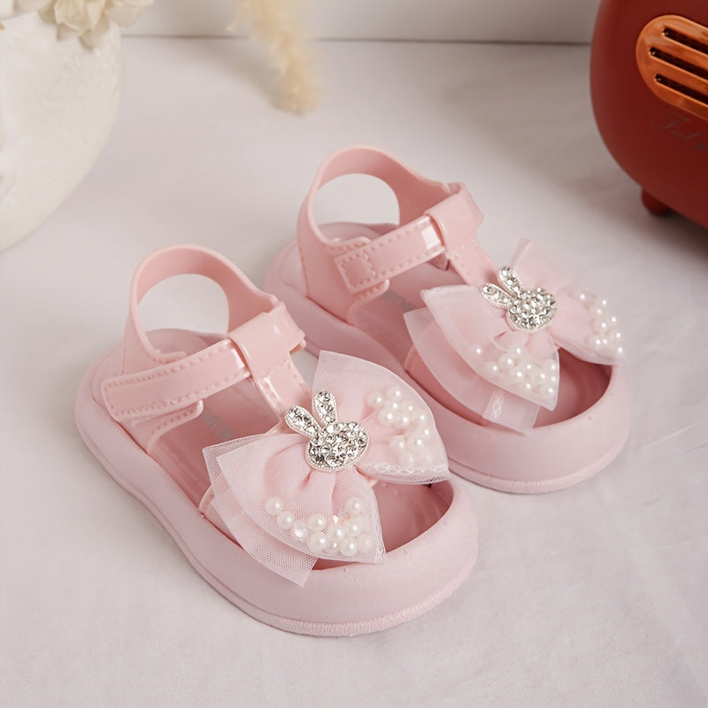 New 2024 baby girl sandals with anti-kick feature, cute rabbit design, and soft soles for beach.