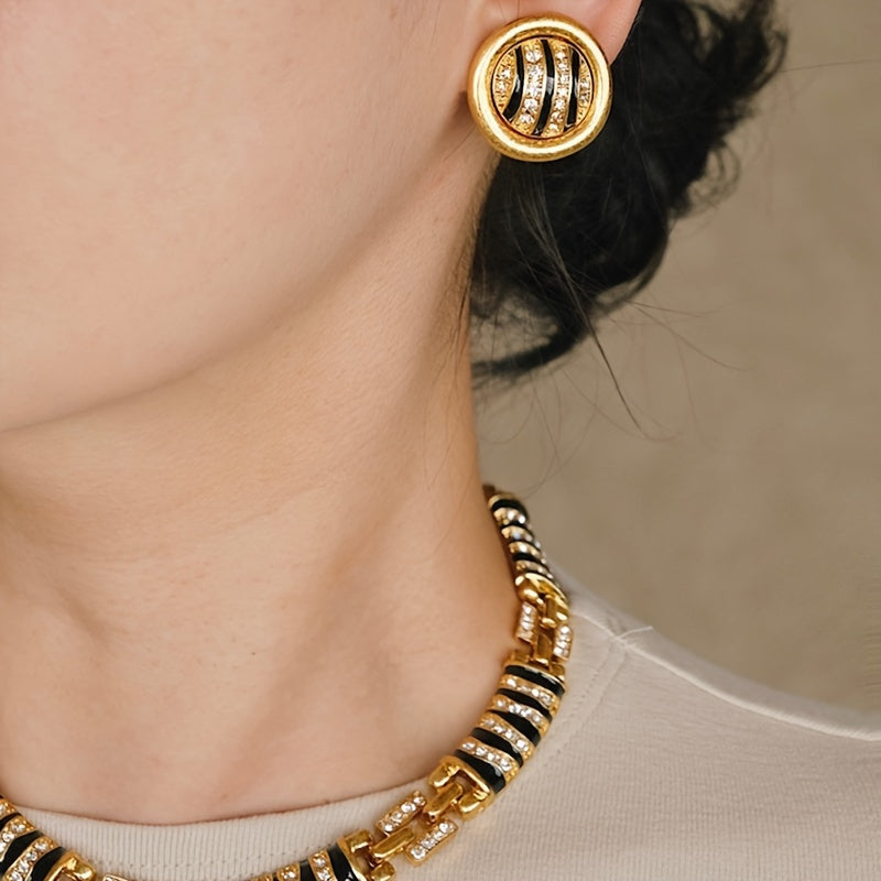 Chic and Stylish French-Inspired Zebra Print Jewelry Set - Featuring Vintage Geometric Design in Gold Plated Enamel with Sparkling Rhinestone Details. Complete with Necklace, Bracelet, and Earrings; Ideal for Everyday Wear, Events, and Celebrations.