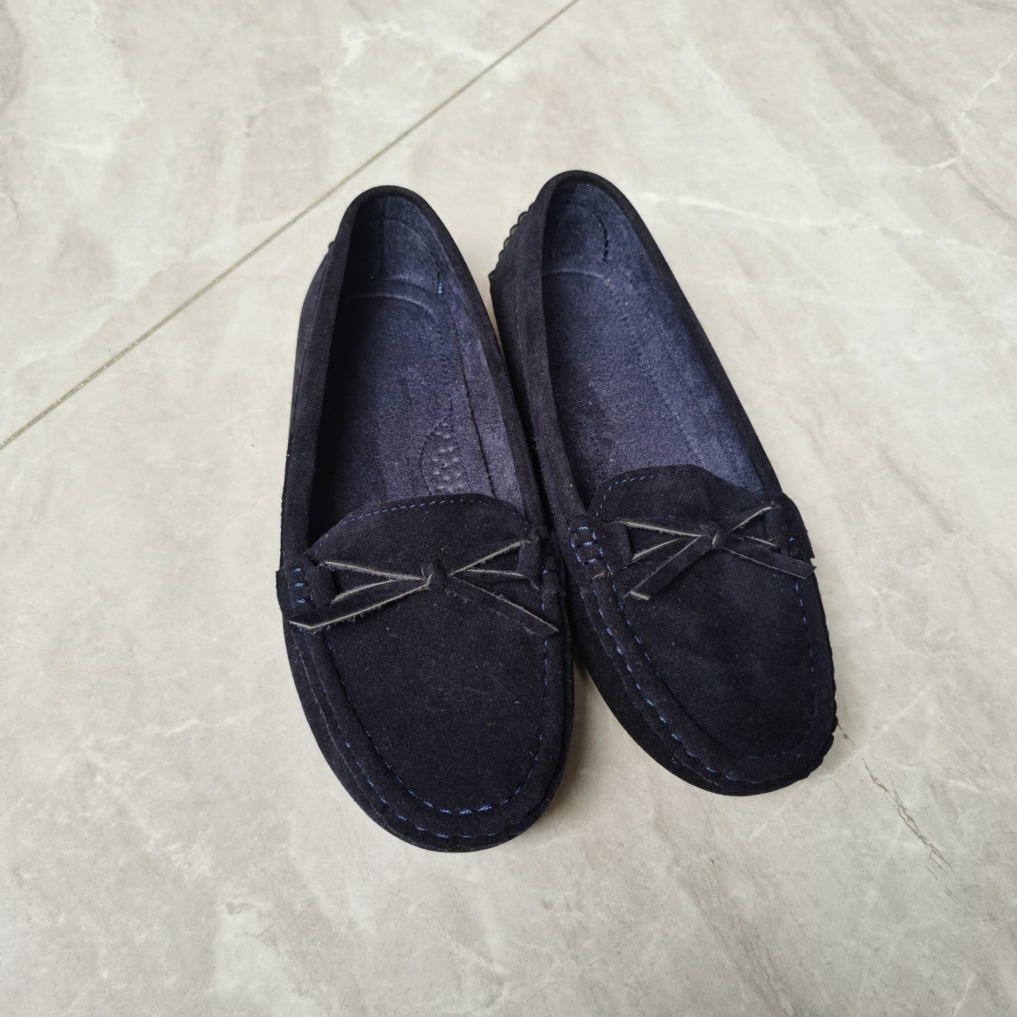 Retro flat loafers with bow detail, slip on style, and soft sole for casual wear.