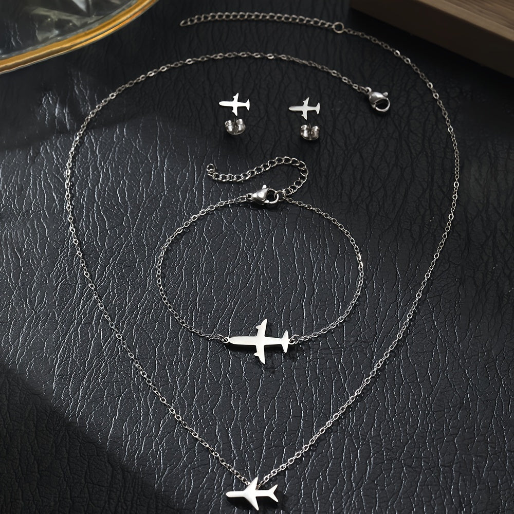 Stylish and elegant 4-piece jewelry set for women featuring stainless steel airplane pendant, chain bracelet, necklace, and earrings. Perfect for adding a touch of charm to any outfit. Makes a great birthday gift for her.