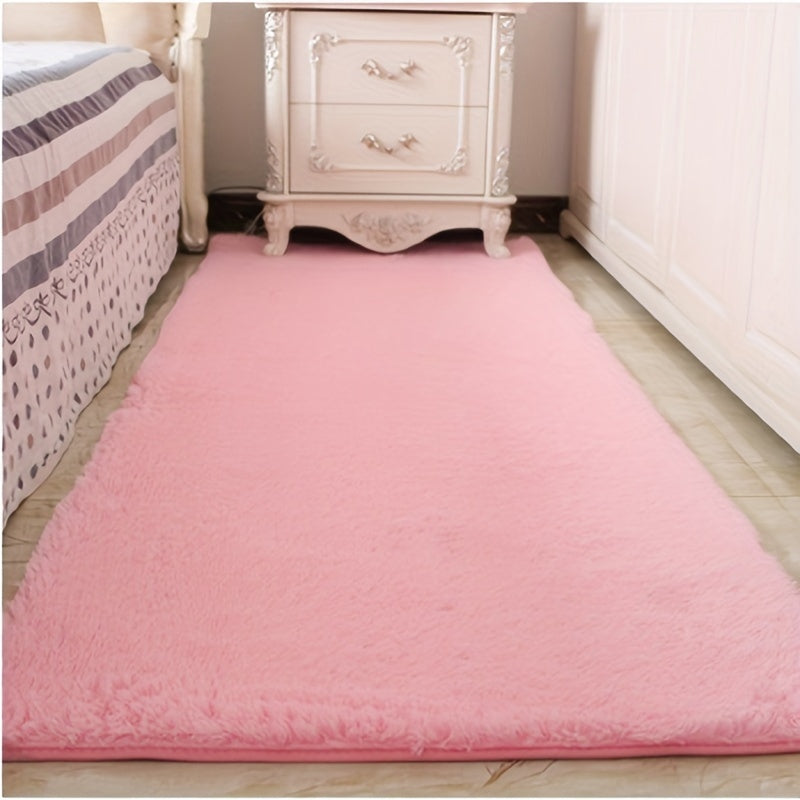 Soft and fluffy pink area rug, machine washable with a shaggy design. Perfect for adding a cozy touch to any living room, nursery, or dorm room. Non-slip and aesthetically pleasing.