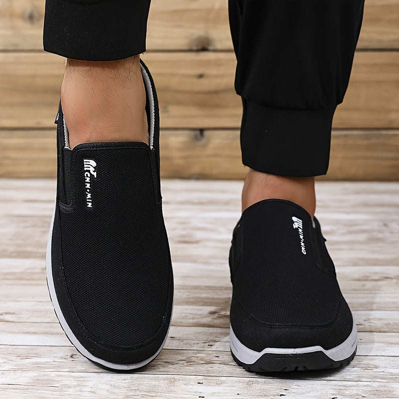 Men's slip-on sports sneakers with breathable fabric upper, round toe, and faux sole for daily wear and running.