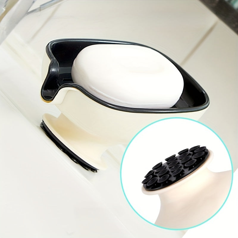 Durable plastic oval soap dish with an elegant, self-draining design for bathroom use.